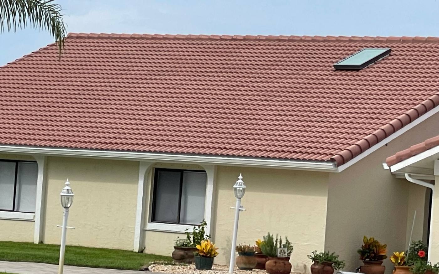 Red clay tile roof with a skylight on a metro Atlanta home