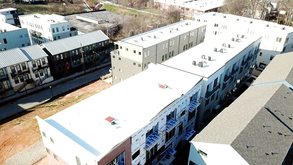 White membrane roofs on new multifamily buildings